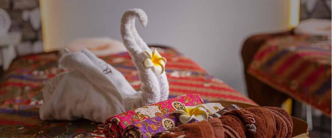 Treatment bed set with a towel swan